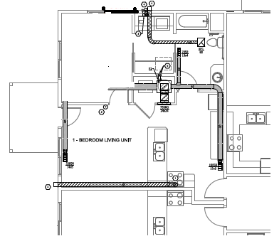 A floor plan of a bedroom living unit with furniture and appliances.